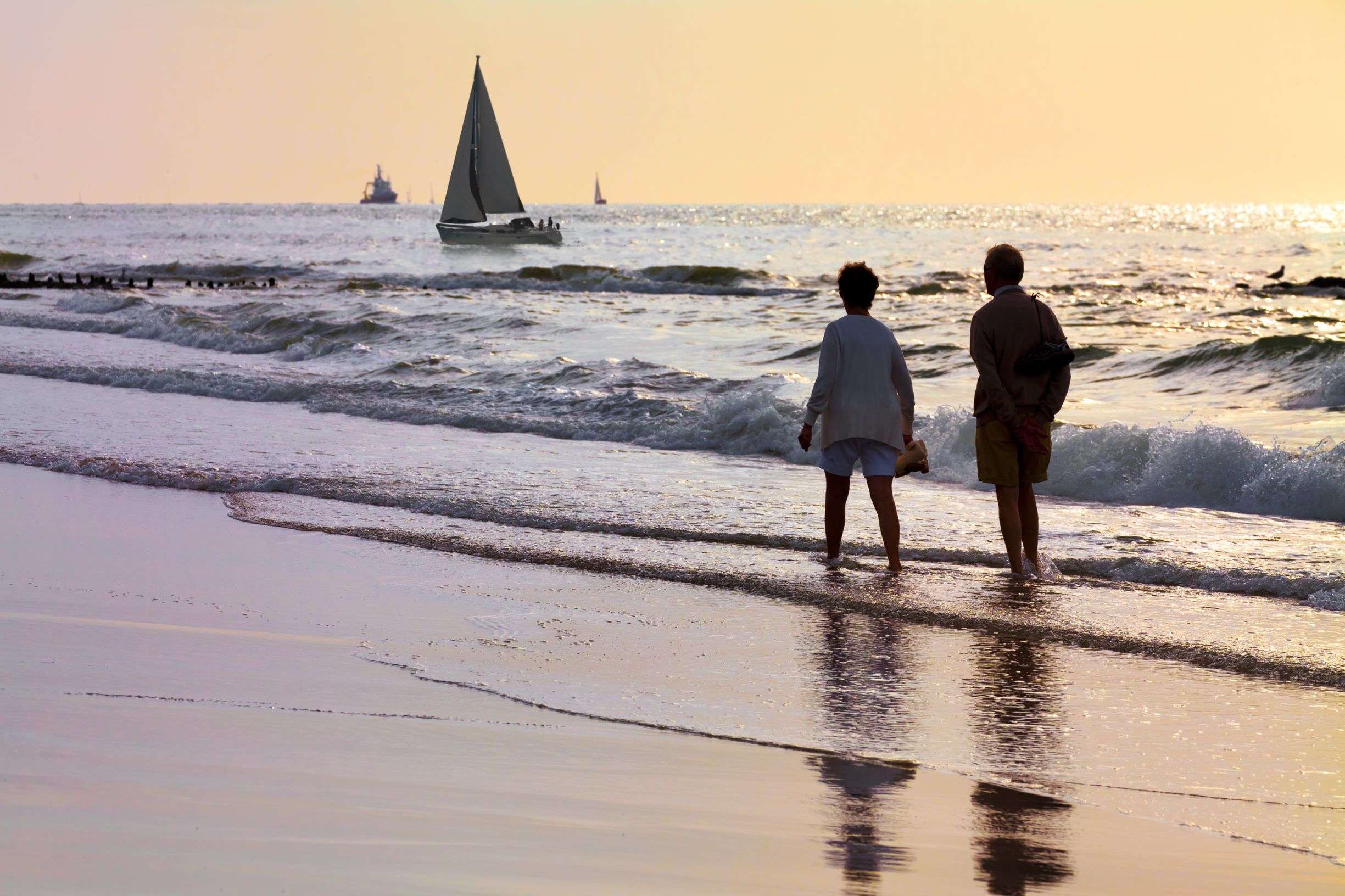 couple walking by sailboats resized