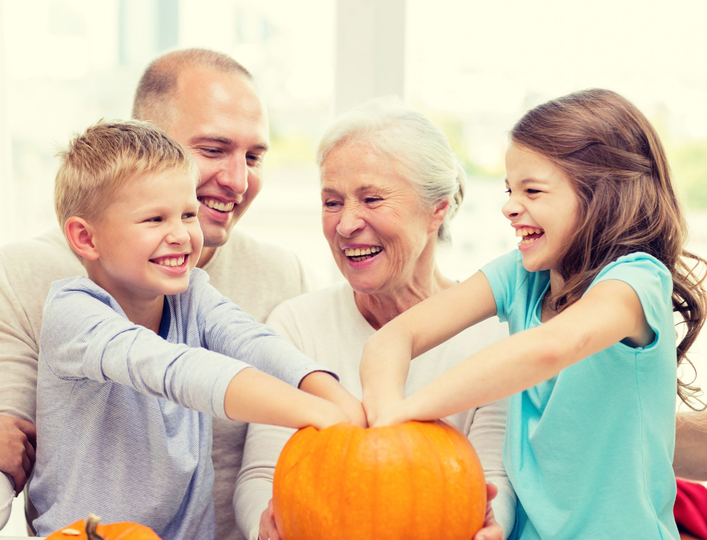grandparents and grandkids with halloween pumpkins resized