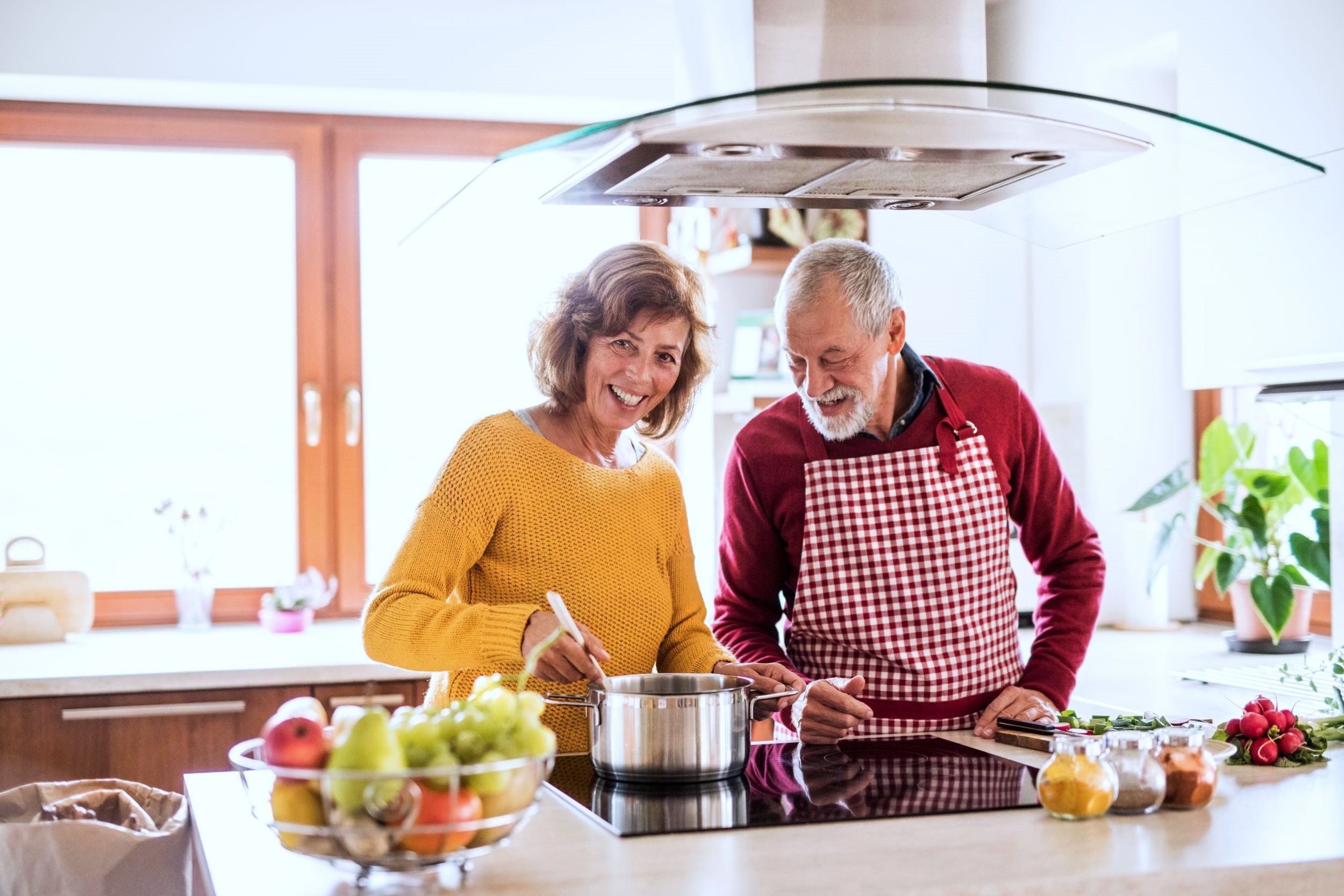 older couple cooking less cool toned